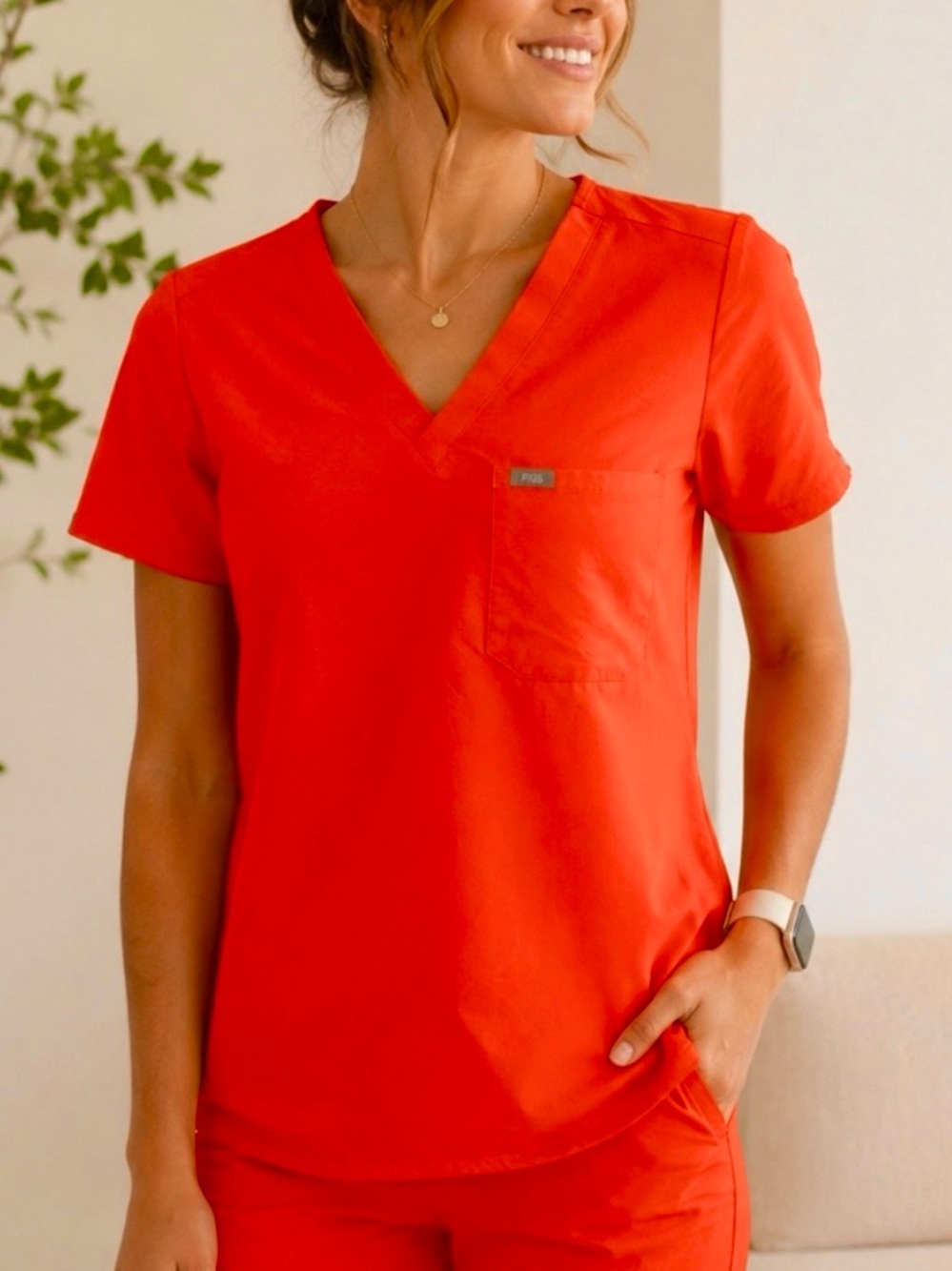 FIGS Technical Collection bright orange v neck scrub top